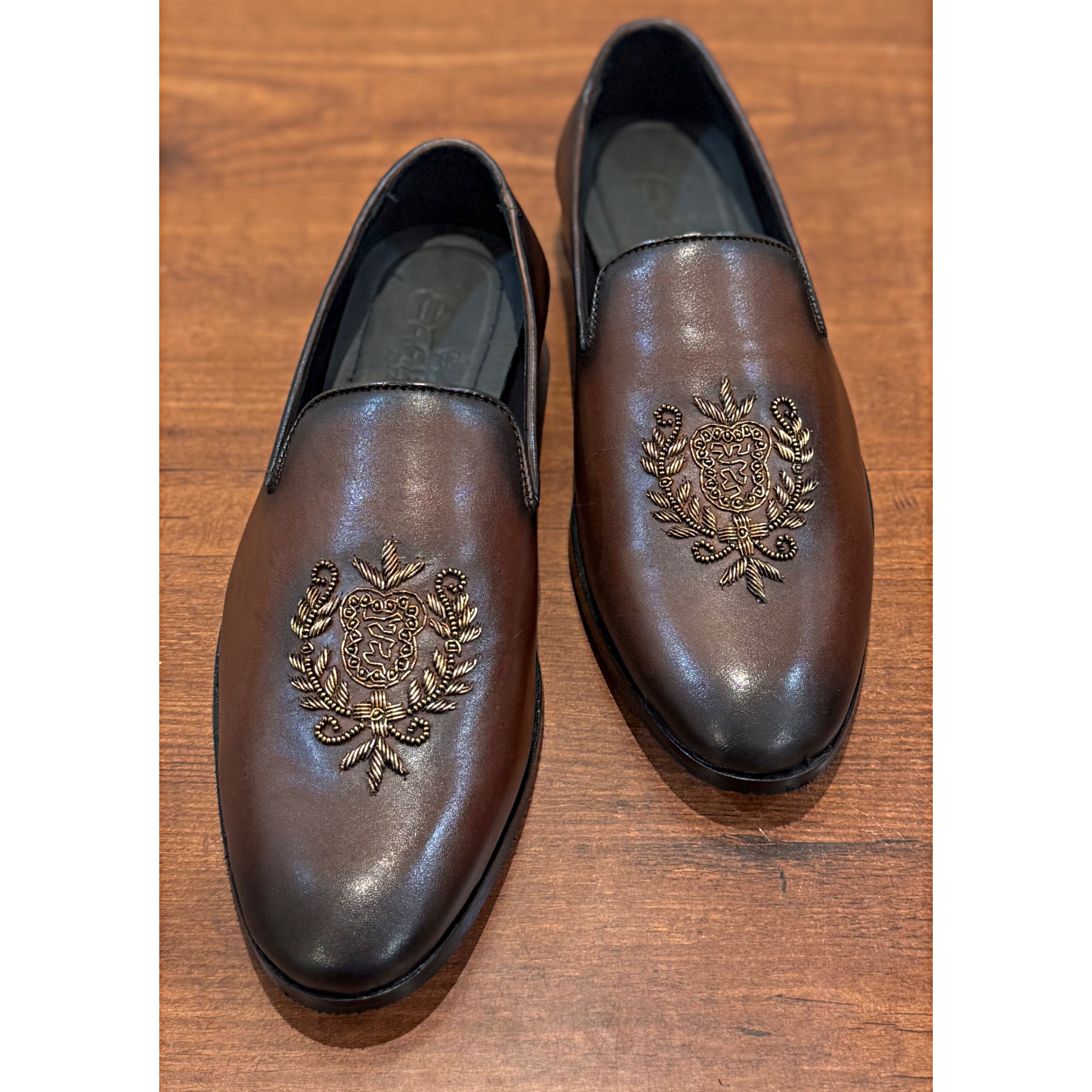 Brown Crest Embroidery Slipons
