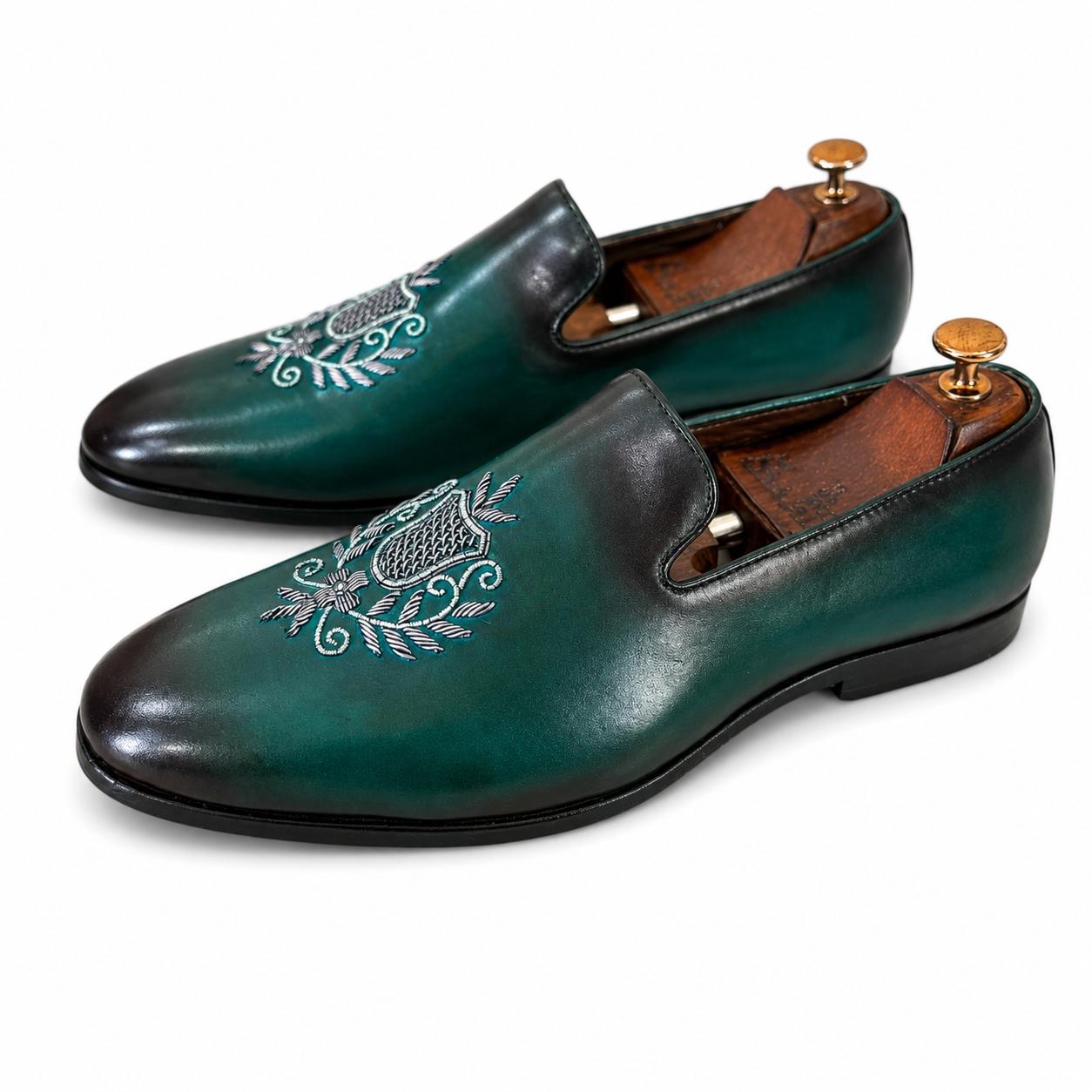 Emerald Crest Embroidered Loafers