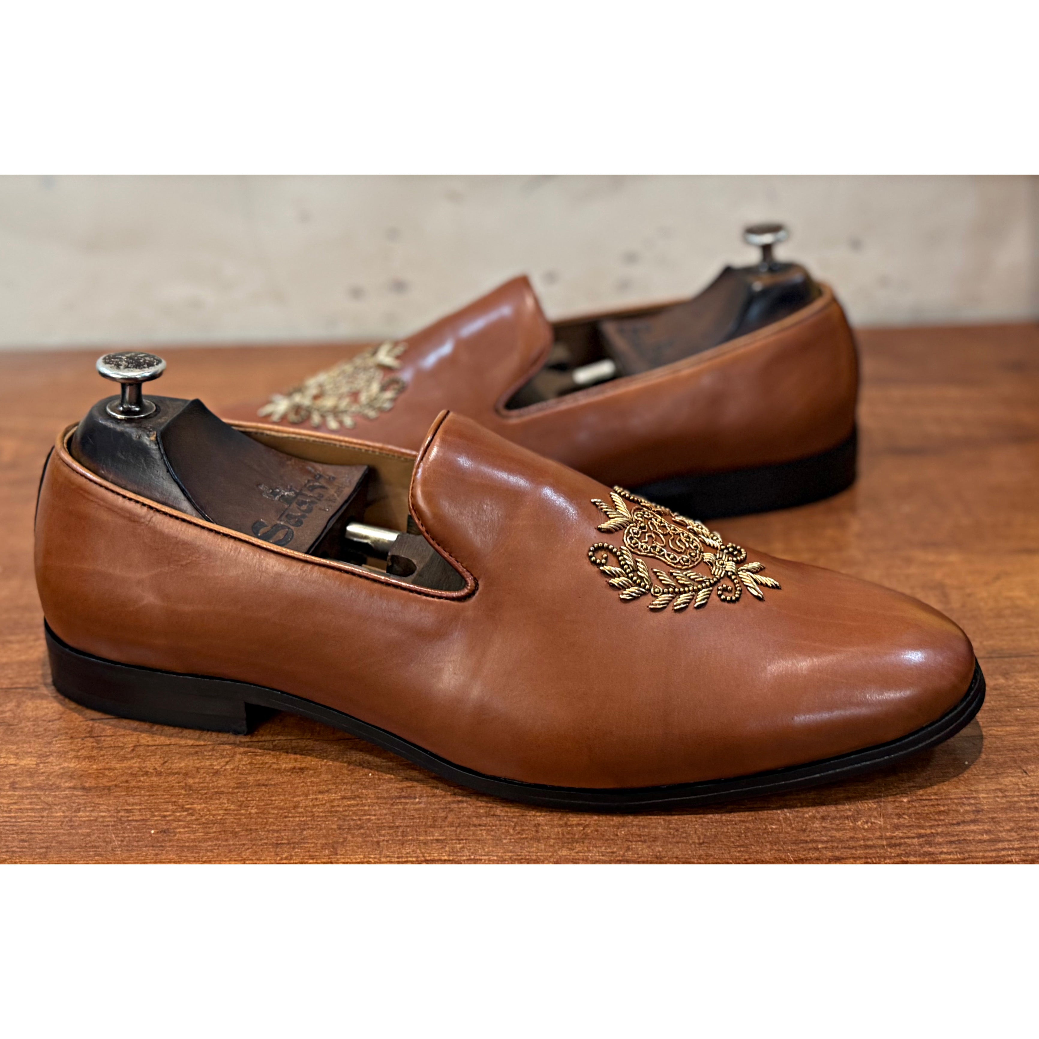 Tan Crest Embroidery Slipons