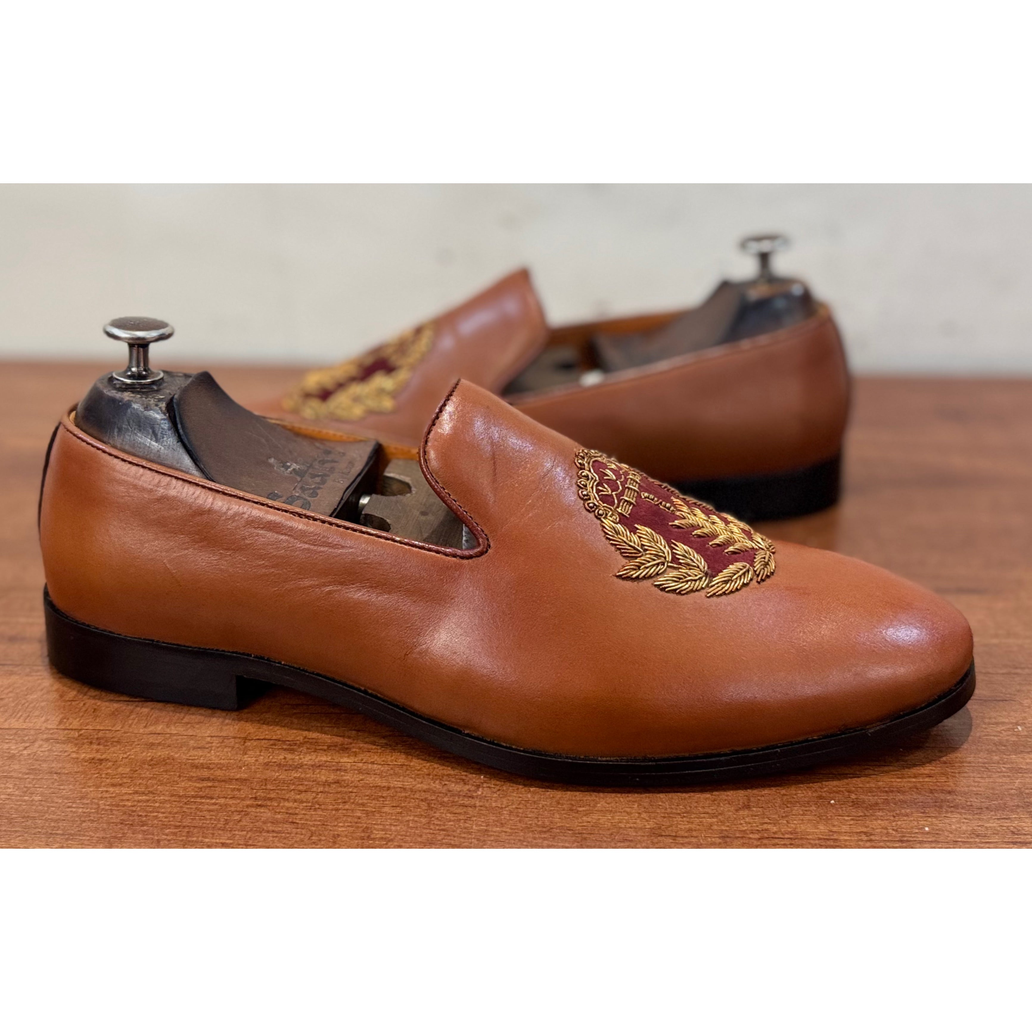 Tan Slipons With Crown Embroidery