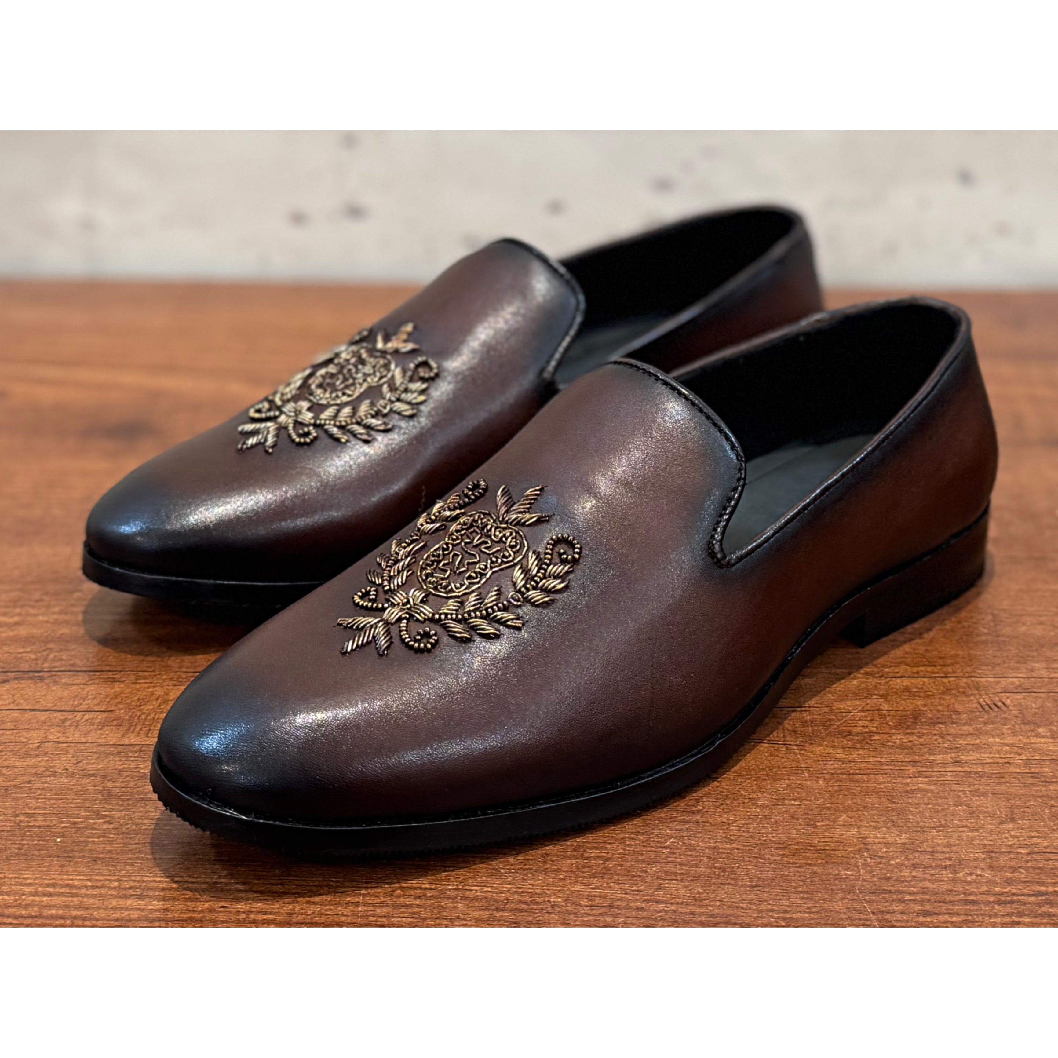 Brown Crest Embroidery Slipons