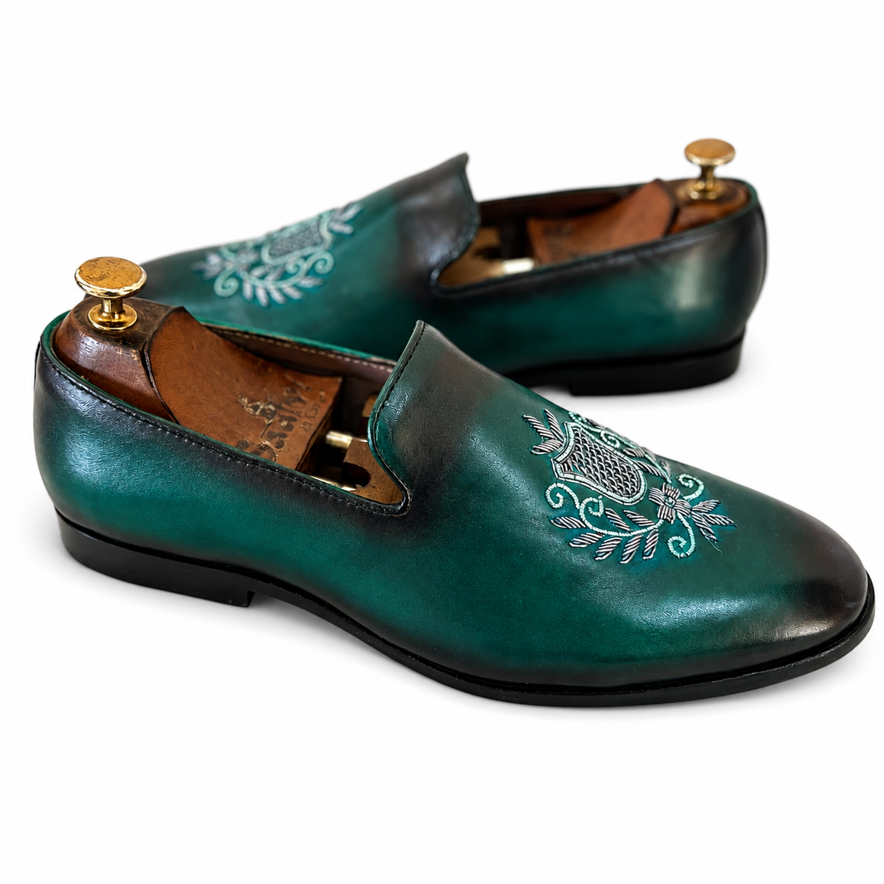 Emerald Crest Embroidered Loafers