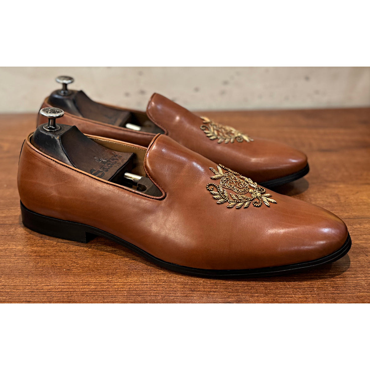Tan Crest Embroidery Slipons
