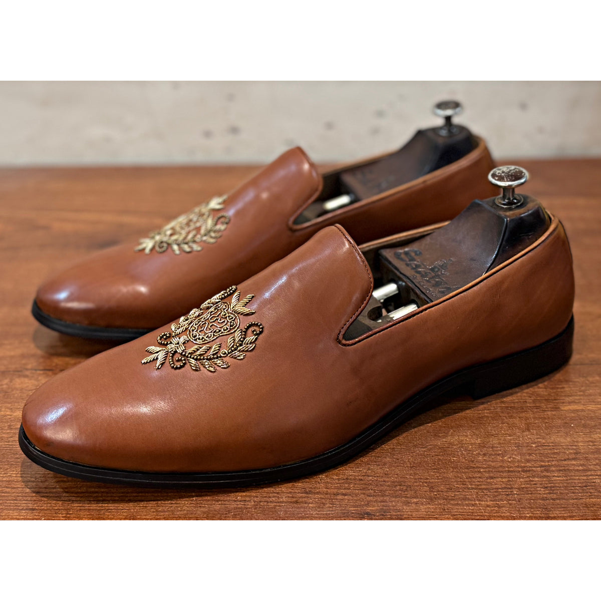 Tan Crest Embroidery Slipons