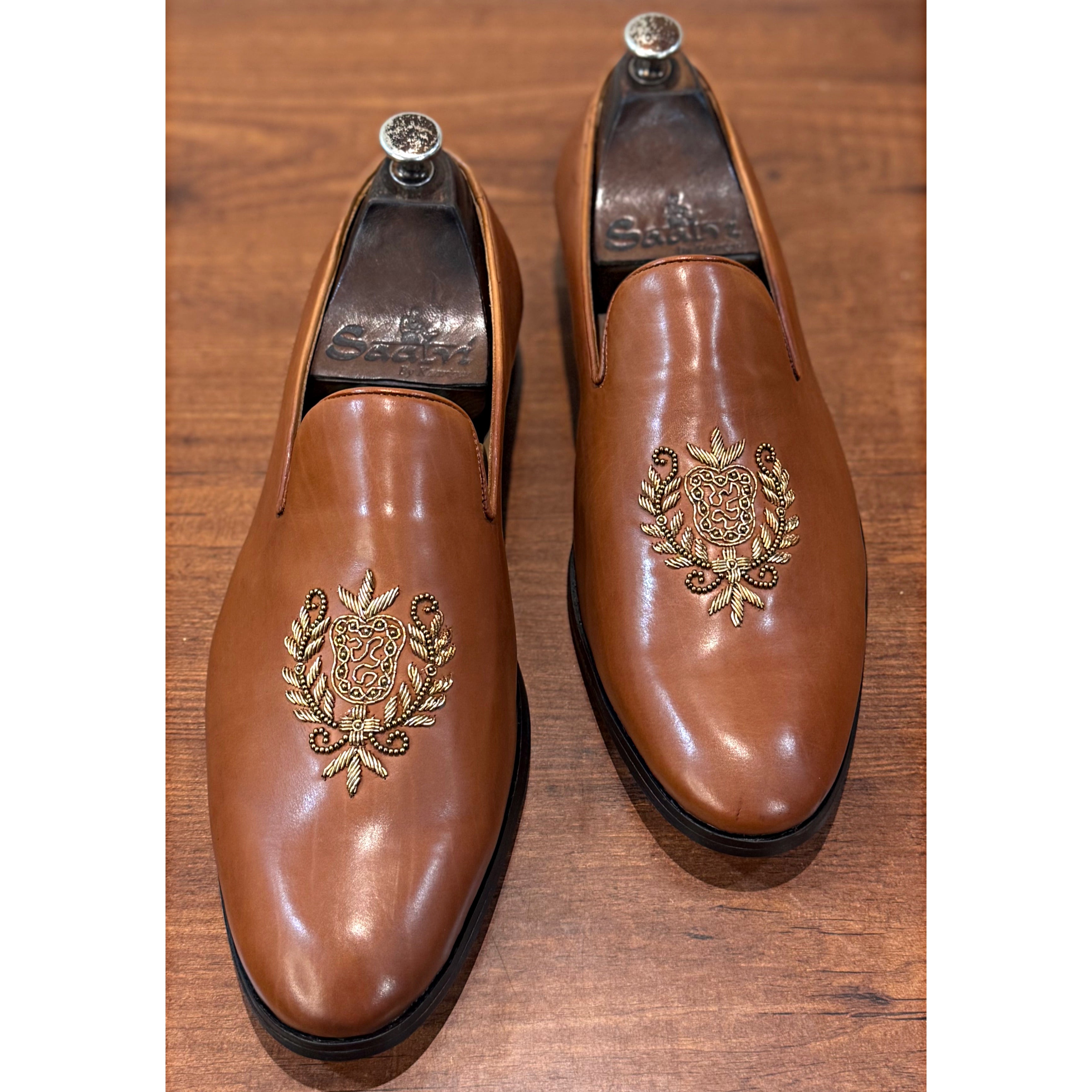 Tan Crest Embroidery Slipons